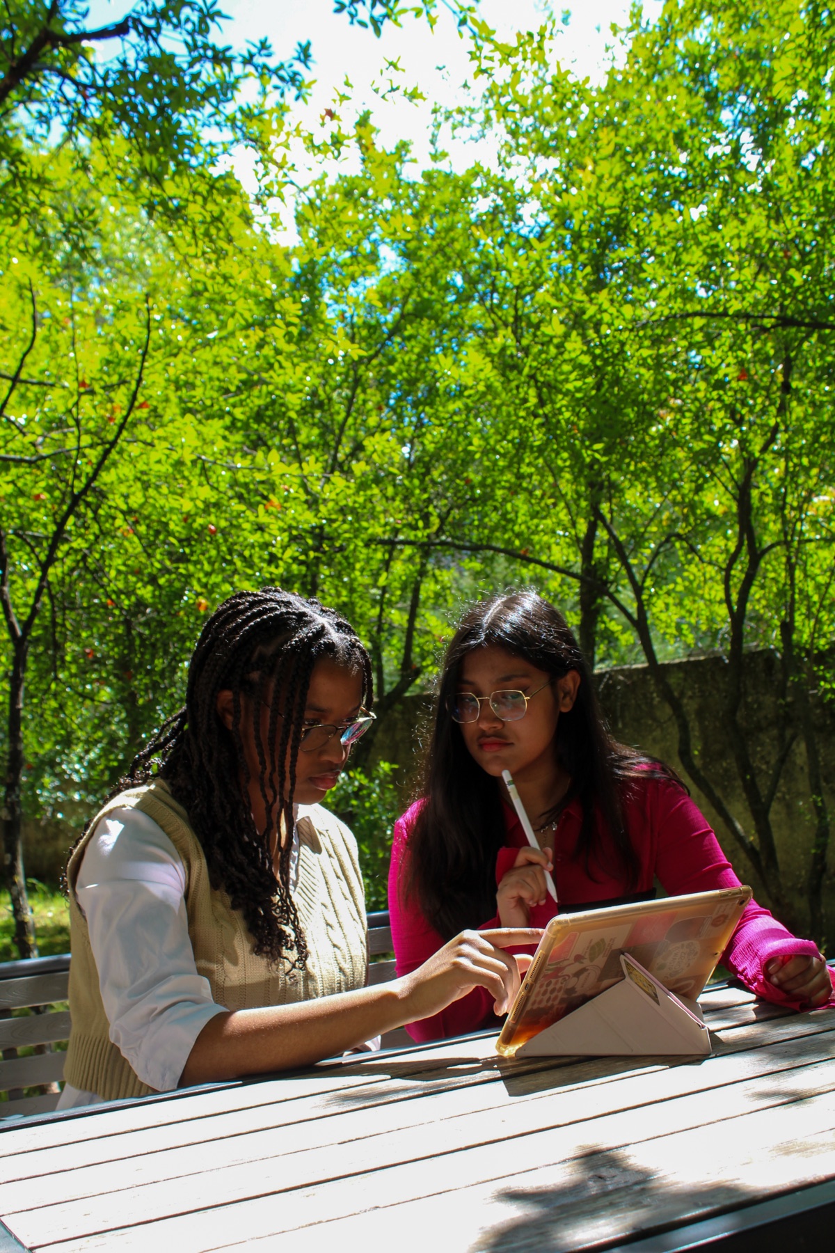 Two students studying together outdoors