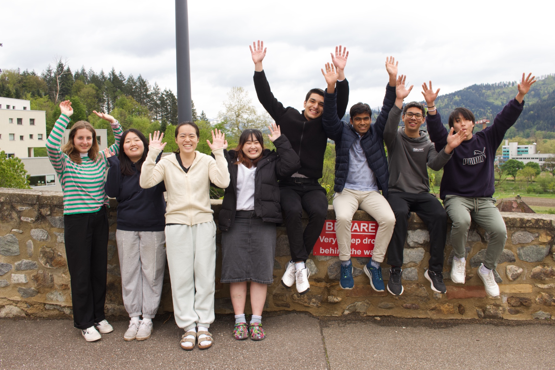 English2Success team smiling and waving together